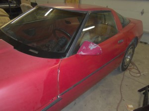 A red 1984 C4 Corvette before being restored. At this point, all I've done is wash the car.