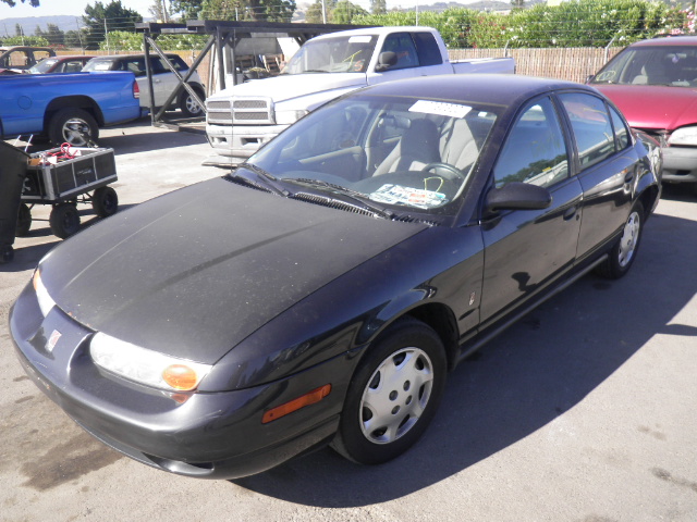 A stock photo of a 2000s Saturn SL1. 